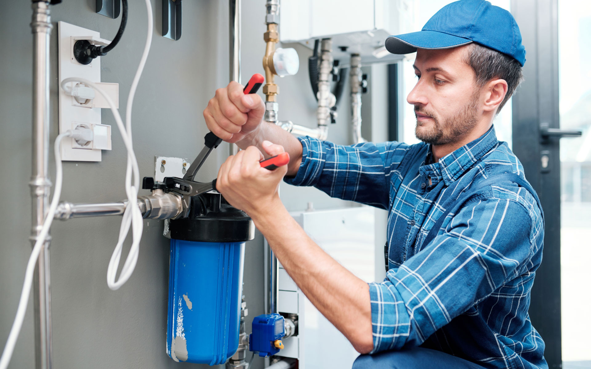Technician servicing a well water filtration system